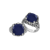 Sterling Silver vintage-inspired ring featuring Blue Sapphire and ornate handcrafted Balinese design.